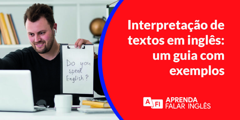 interpretação de textos em inglês - um homem de preto sentado no computador olhando o notebook